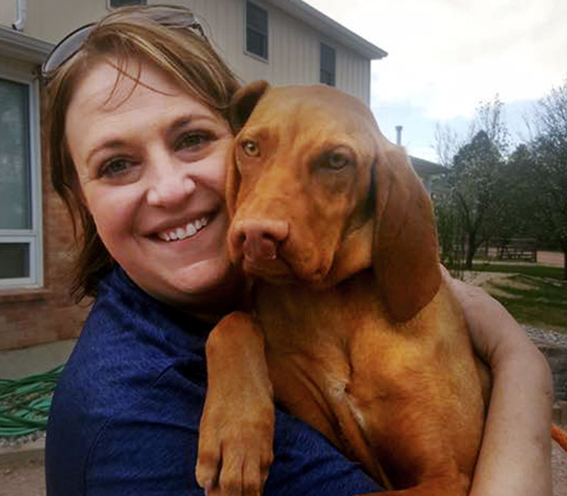 Becky our Adoption Coordinator and Clifford. Home from the shelter and on to a better life.